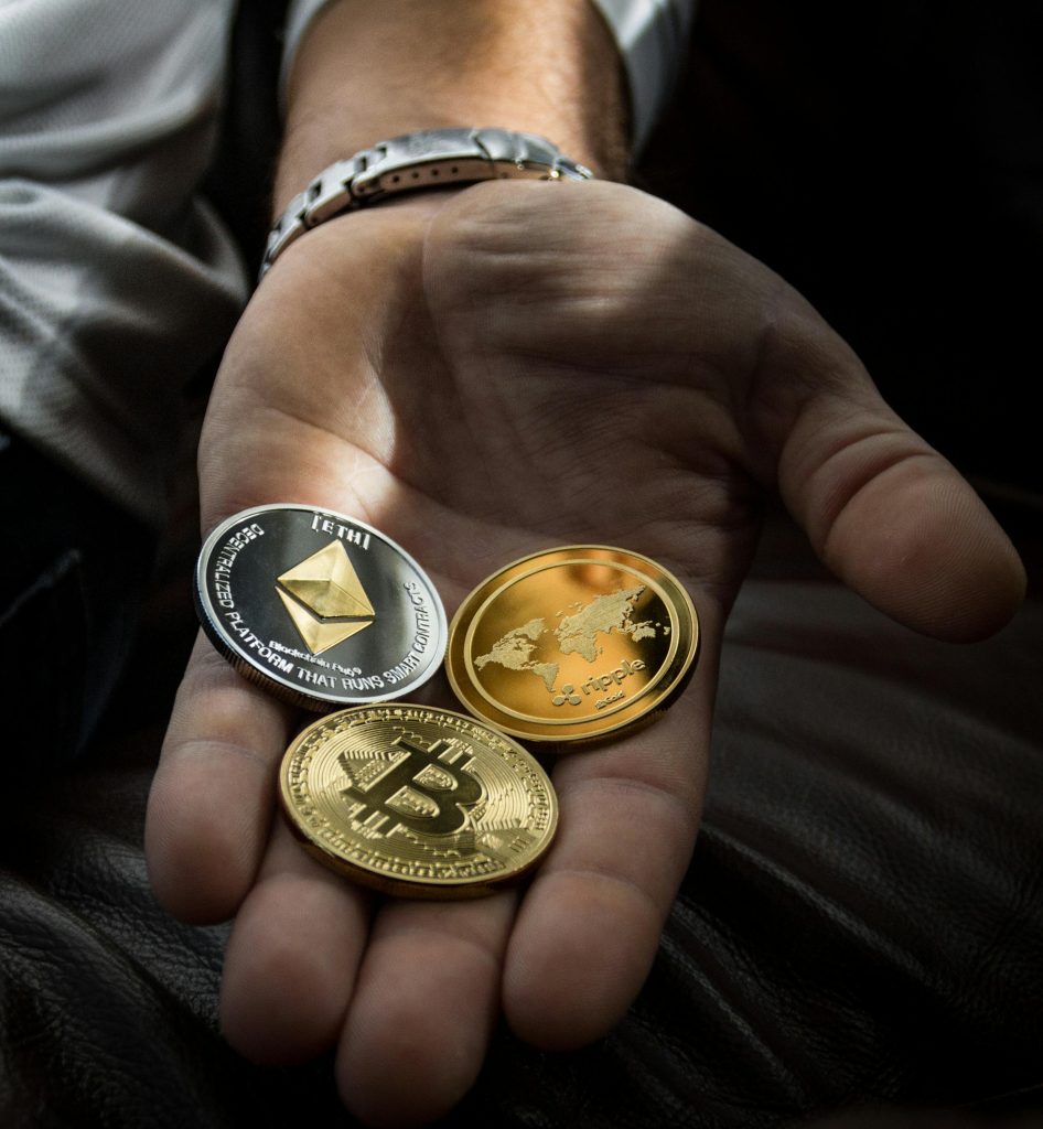 Image of a crypto coins in someones hand